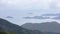 Landscape and seascape mountain and the sea and shipping cargo containers in the rain season at viewpoint ngong ping 360 cable car