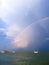 landscape seascapes sea ocean water storm rainbow ship ships