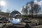 landscape seen through a gals ball. In the background the steam from a cooling tower