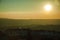 Landscape and several wind turbines silhouettes on sunset