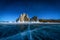 Landscape of Shamanka rock and star on sky with natural breaking ice in frozen water on Lake Baikal, Siberia, Russia