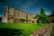 Landscape shot of abbazia di san galgano in monticiano italy with a clear sunny blue sky