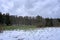 Landscape shot of clouds, grass and mountains in Germany, Vulkaneifel in Rhineland-Palatinate in spring