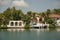 Landscape shot of a house nearby a tropical, peaceful lake