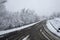 Landscape shot of the Italian Apennines road covered in snow in Vezzolacca, Italy