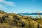 Landscape shot of mount cook and snow covered mountains around in new zealand south island with green countryside in the
