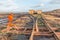 Landscape shot of a peat mining area with rails and crossover of