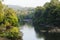 A landscape shot of a river passing through a forest