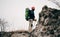 Landscape shot of traveler bearded man trekking and mountaineering during his journey. Tourist young male hiking in mountains