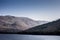 Landscape shot or view of mountains in the early morning with sunlight and flair over it.