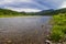 Landscape of Siberia. Kiya River, mountain banks and green forests in the Kemerovo region. Panorama