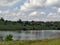 Landscape, sky, clouds, lake, grass and trees