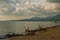 Landscape sky with clouds, volcanic sand on the beach. Pandan, Panay, Philippines.