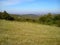 Landscape of slope Fruska mountains in Serbia in early autumn. Steep slope after haymaking. Dry grass is trimmed. In the