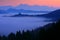 Landscape in Slovenia, nature in Europe. Foggy Triglav Alps with forest, travel in Slovenia. Saint Thomas Church, Sveti Tomaz nad