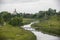 A landscape of small religious village - a bridge over the stream