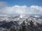 Landscape of snow and cloud tops of mountains