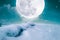 Landscape at snowfall with super moon. Serenity nature background.