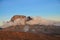 Landscape of the snowy Mawenzi peak of Mount Kilimanjaro under sunlight covered with clouds