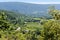 Landscape in South Europe with an old winery, vineyards, fields