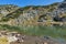 Landscape with Stones in the water in small Lake, Rila Mountain