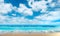 Landscape, summer tropical beach. Azure sea, ocean, waves, surf, blue sky with cumulus clouds, ,sand. Design concept for travel,