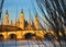 landscape of a sunrise on catholic basilica pilar in Zaragoza besides the Ebro river with some trees and plants at first site. The