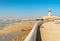 Landscape of Sur with Al Ayjah Lighthouse with fish boats on the beach, Sultanate of Oman