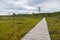 Landscape of Tolkuse bog with plank pathway