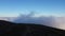 Landscape from the top of the mountain with clouds close to the ground. alpine sea seen from high altitude. amaizing colors at sun