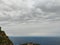 Landscape with town sea, water, rocks and sky in Taormina beach.