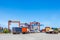 Landscape of truck, containers and crane at trade port