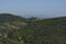 Landscape of the Tuscan hills with natural woods and Campiglia Marittima, Italy