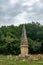 Landscape of Tuscany with monument along via Francigena, Italy