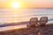 Landscape of Two Lonely beachchairs near sea and beautiful sunrise