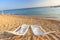 Landscape of Two Lonely beachchairs on the sand near sea