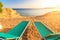 Landscape of Two Lonely beachchairs on the sand near sea