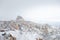 Landscape of Uchisar Castle from Pigeon Valley with snow in the winter season at Cappadocia in Turkey