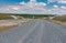 Landscape in Ukraine with stone layer of unfinished highway near Dnepr city