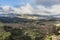 Landscape of the valley or Vega of Ronda with farmland and mountains in the background