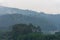 Landscape of a valley with wooded hills after a summer storm, horizonta