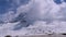 Landscape view of Alpine Mountain Snowy Peak in the Clouds. Simplon Pass.