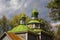 Landscape view of ancient wooden cossack church against cloudy sky. Few minutes before spring thunderstorm