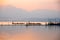 Landscape view - boatman paddle boat in the lagoon lake.Kwan phalandscape view - boatman yao in evenign time at phayao thailand