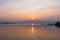 Landscape view - boatman paddle boat in the lagoon lake.Kwan phayao in evening time at phayao thailand