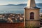 Landscape view of City of Rijeka, belfry in the front.