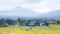 Landscape view of cloudy on sky over the mountain green field