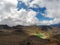 Landscape view of colorful Emerald lakes and volcanic landscape with hikers walking by, Tongariro national park, New Zealand