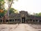 Landscape view of demolished stone architecture and aerial tree root at Preah Khan temple Angkor Wat complex, Siem Reap Cambodia.