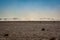 Landscape view in desert with mountains and small sand storm in Morocco